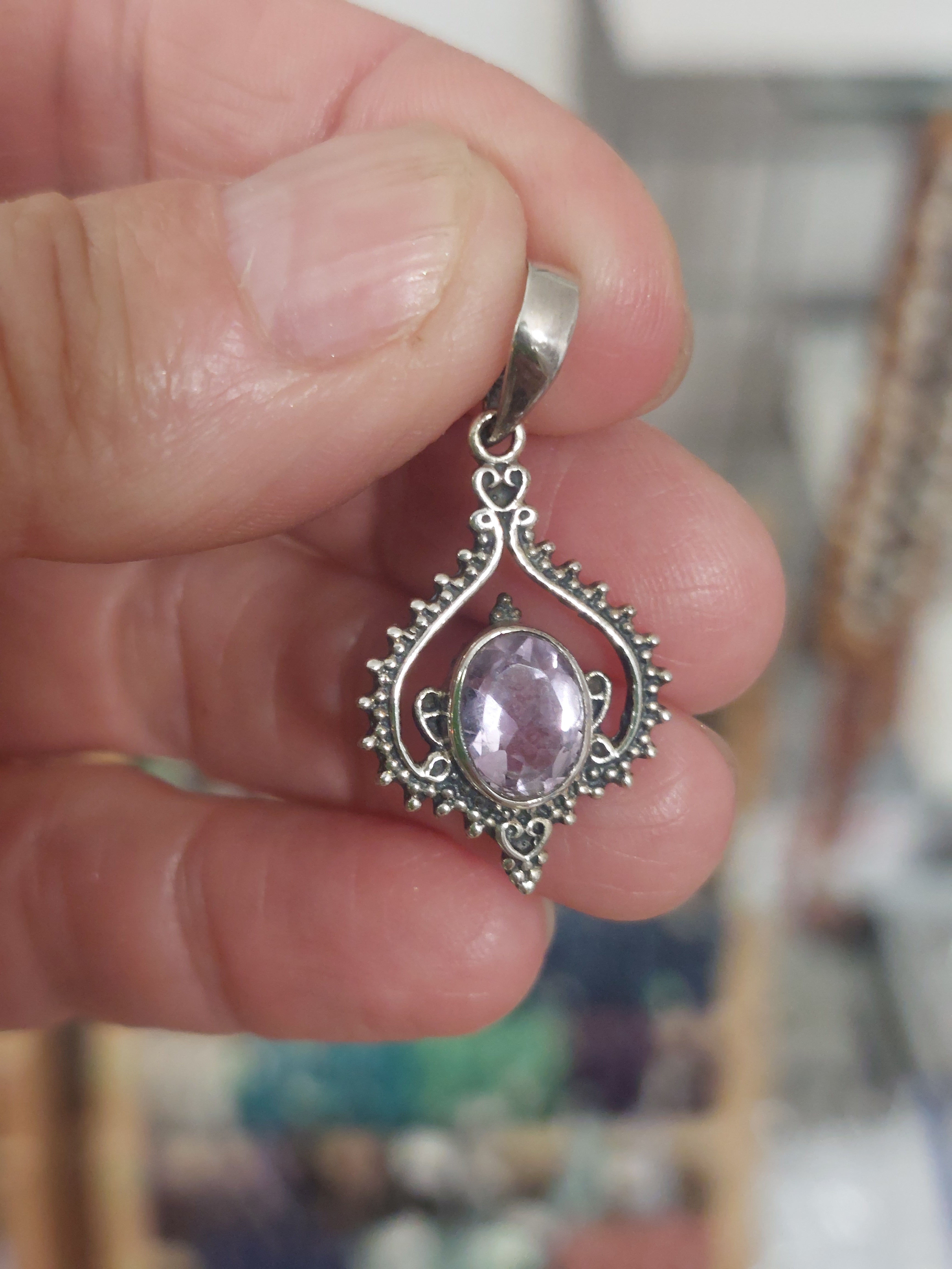 Amethyst Faceted Oval in Fancy Boho Inverted Heart Surround - 925 Sterling Silver