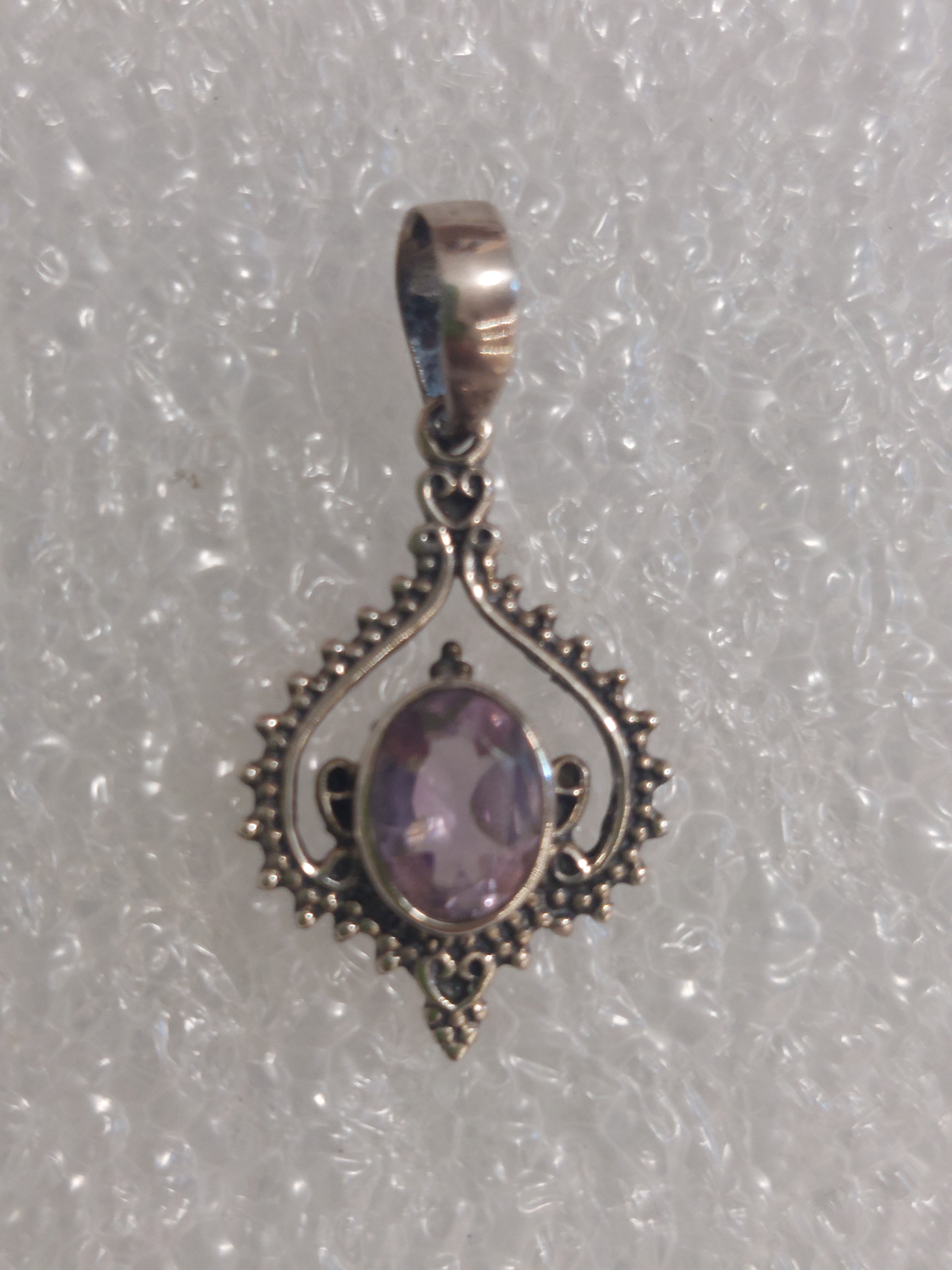 Amethyst Faceted Oval in Fancy Boho Inverted Heart Surround - 925 Sterling Silver