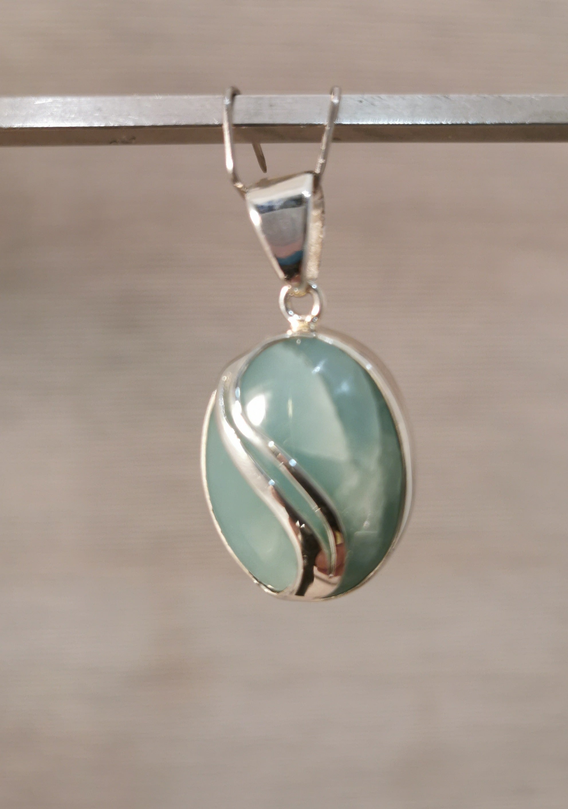 Aquamarine Oval Pendant - 925 Sterling Silver with Decorative Wave Pattern